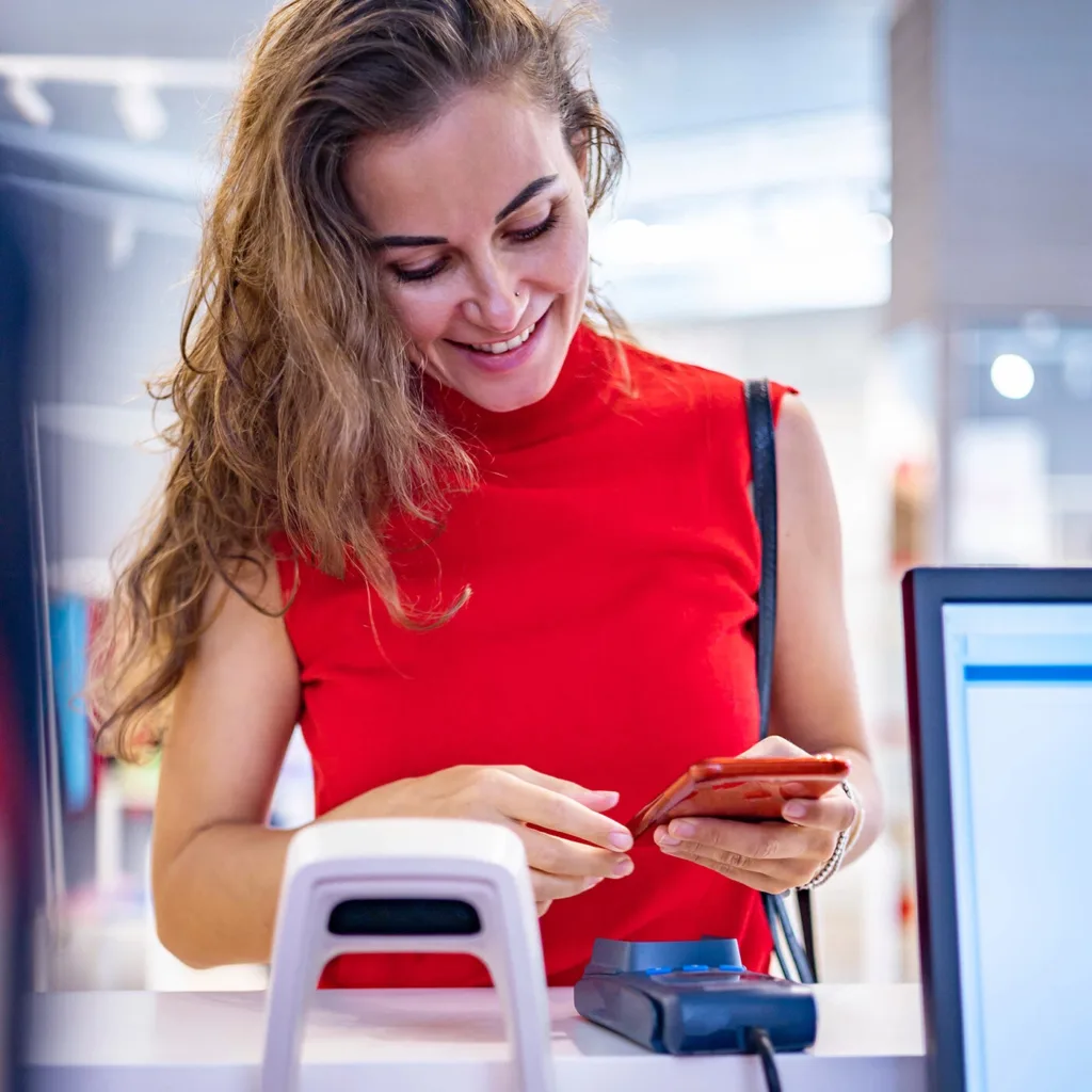 Customer using phone to complete purchase transaction